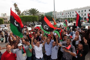 People celebrate in the streets, amid reports that Moammar Gadhafis death by anti-Gadhafi forces overwhelmed his hometown of Sirte, in Tripoli, Libya, on October 20, 2011. Even before confirmation of ousted Libyan leader Moammar Gadhafis death came from the nations interim government Thursday, Libyans erupted in jubilation after early reports said he had been captured or killed. (Erhan Sevenler/AA/Abaca Press/MCT)