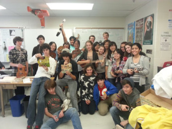 The Ukulele Club shows off their playing skills in Joanne Reynolds room.