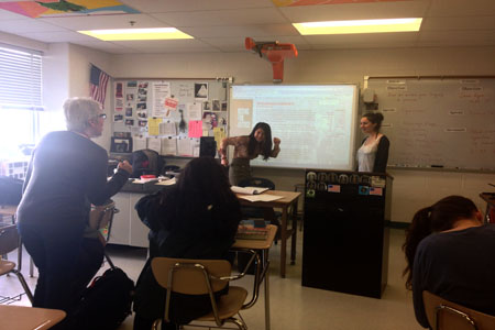 Senior Sarah Pratt fools around with Feminism Club advisor Joanne Reynolds during a meeting. 