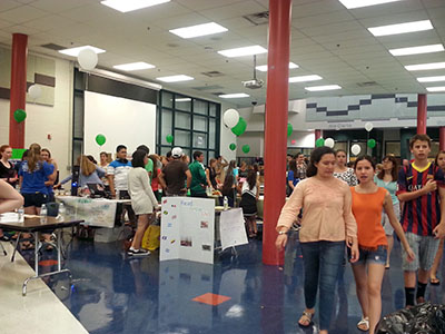 Students and parents alike learn about the various clubs and organizations offered at WJ during the New Student Picnic, which took place in the cafeteria due to rain.