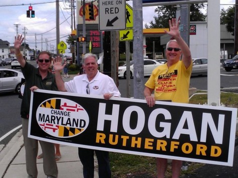 Newly elected governor Larry Hogan shown holding a campaign poster with some of his supporters. 