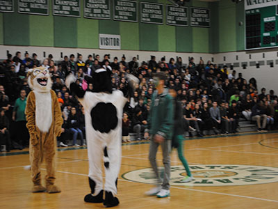 The SGA president and vice president work with the mascots to get everyone pumped for the pep rally.