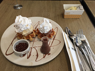 One of the many Max Brenner desserts is the Munchies pearl sugar waffle, complete with a flask of melted chocolate and a small bowl of chocolate beads for (optional) toppings.