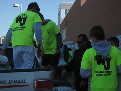 WJ students haul mulch at one of WJs annual mulch sales, which are organized by the Booster Club to give back to the school.