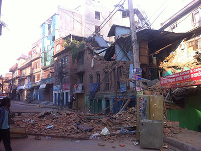 The immense destruction caused by the earthquake in Nepal is heavily reflected on this damaged building.