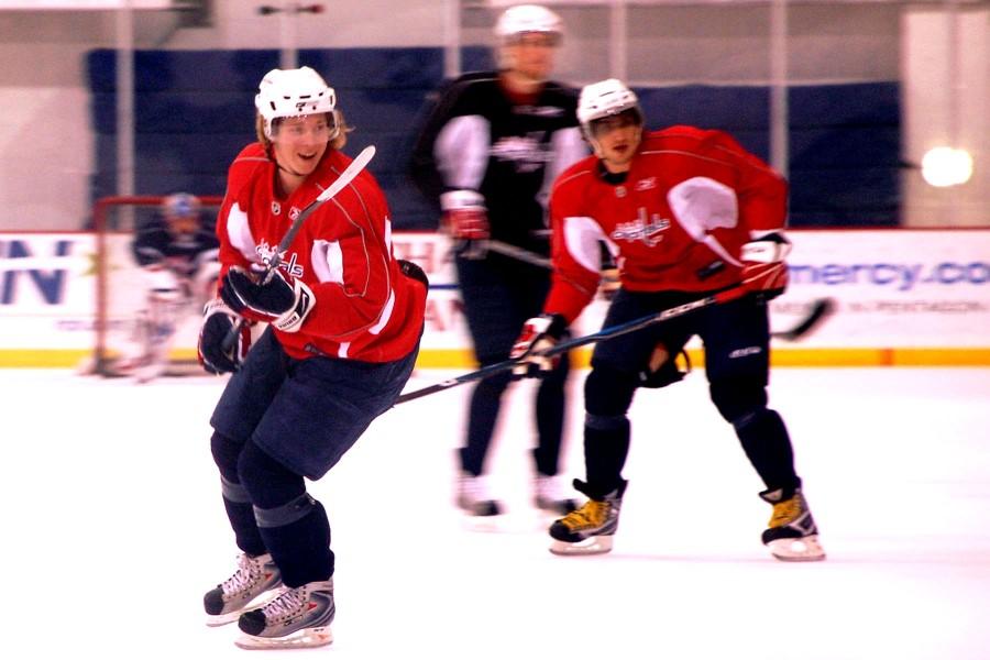 Alex Ovechkin and Nicklas Backstrom share a laugh at practice
