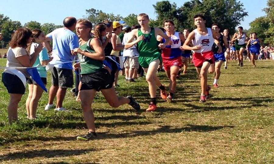 Senior runner Carter May leads the pack in an earlier meet.