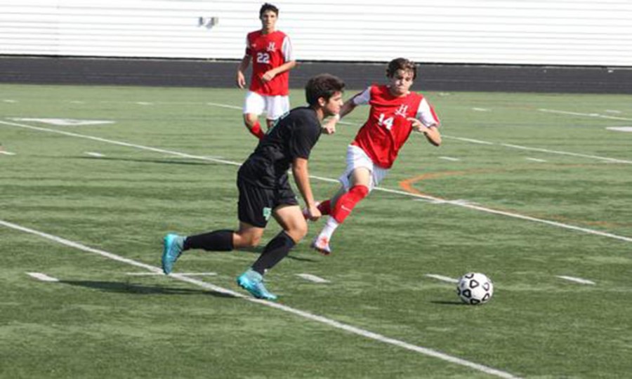 Senior captain Zach Labonski looks to pass in the game.