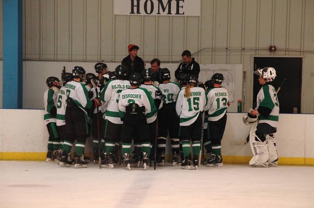 The team huddles together to discuss strategy. Photo credit of Brando Kobernick