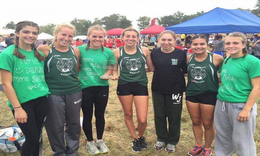 WJ girls cross country, the reigning state champions, are seen here after winning a race at an invitational meet earlier this year.