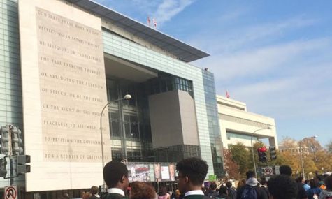 The protesters walk past the Newseum, which displays a quote from the Bill of Rights about the freedom of peaceful assembly. Photo by Yael Hanadari-Levy.