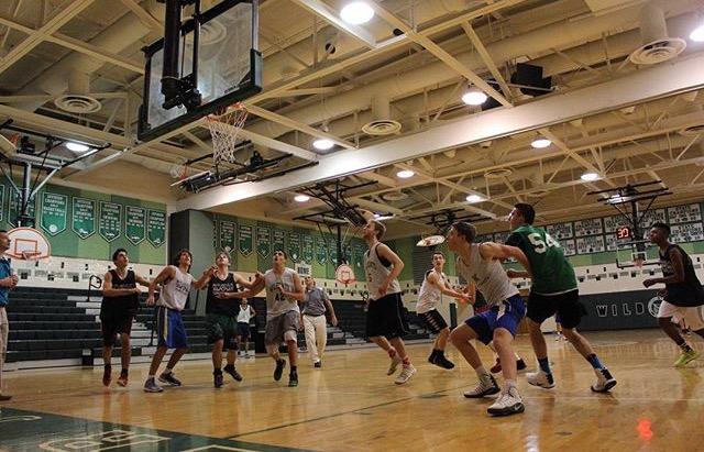 The Boys Basketball team practices rebounding as they prepare for their next game. Photo Courtesy of Alison Druhan