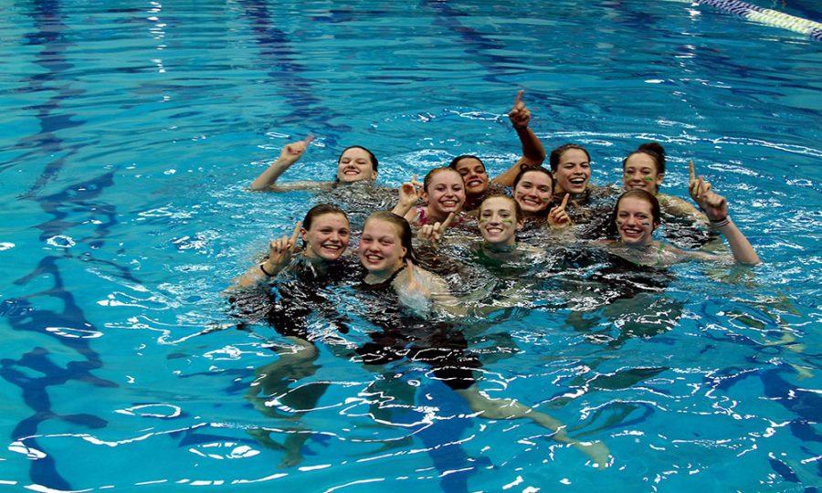 WJ girls swim and dive race to victory at Metros