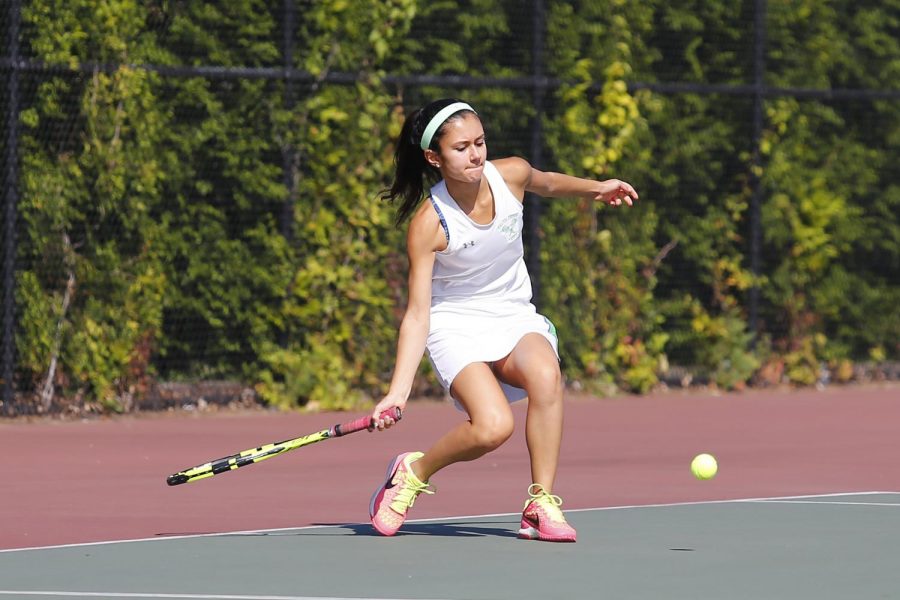 Junior Nikki Emamian hits a great shot in one of WJs many victories. Emamian became a team captain this year.