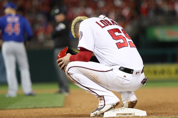 WASHINGTON, DC - OCTOBER 13: Jose Lobaton #59 of the Washington Nationals reacts after being picked off against the Chicago Cubs during the eighth inning in game five of the National League Division Series at Nationals Park on October 13, 2017 in Washington, DC. (Photo by Patrick Smith/Getty Images)