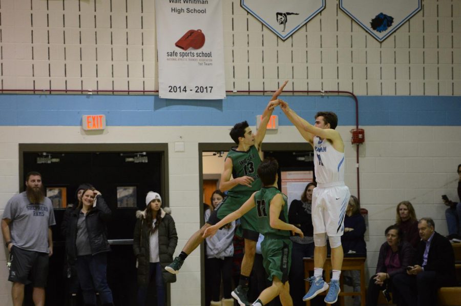 Senior captains William Koenick and Nick Bournias jump to block their opponent’s shot. Koenick and Bournias have been leading scorers for the team throughout the season. 