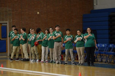 The Bocce team says the pledge before the game against Churchill. Image Courtesy of Lifetouch
