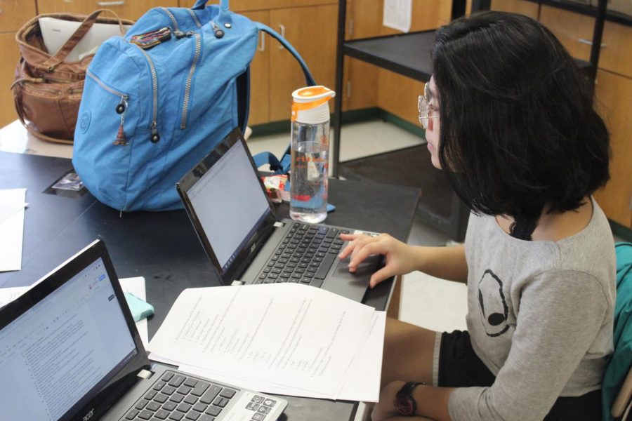 Science Olympiad member and senior Gillian Audia reviews a test for preparation. Photo by Jack Linde.