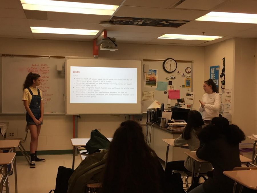 Girl Up members junior Emma Jean Thomas and sophomore Mallory Laing educate others on the importance of girls education.  