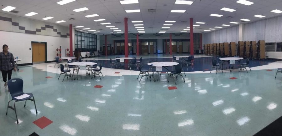 Senior Jessica Lee sets up the tables prior to the first ever WJ Puzzle Tournament. The tournament was held on December 15. Picture courtesy of Jessica Lee.