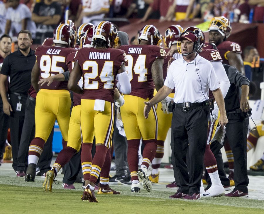 Washington Redskins players walk off the field after the game against the Oakland Raiders. The Redskins ended their season after a loss to the New York Giants.