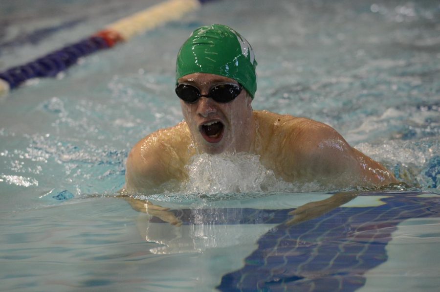 Junior Timmy Ellett swims breaststroke during a meet. Ellett’s strong swimming is one of the reasons the boys have performed so well after last year’s disappointing season. Photo courtesy of Lifetouch Studios