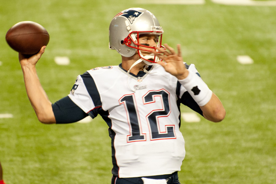 Brady looks down the field to throw a pass.  The Patriots pulled off a miraculous win in last years Super Bowl, as they came back from a 28-3 deficit.   
