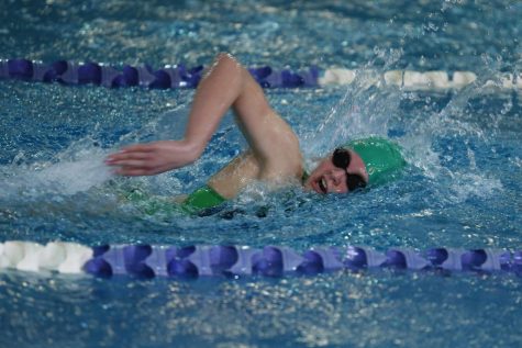 Sophomore Molly Benson takes a breath during the freestyle. Photo courtesy of Lifetouch Studios