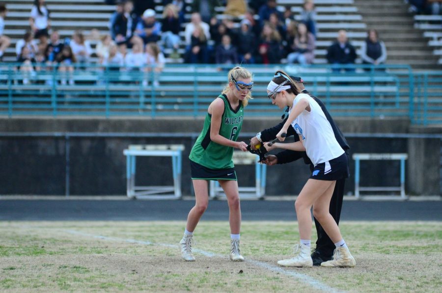 Junior Claire Mallory in action against Whitman. WJ lost that game however, 12-7. Photo courtesy of Lifetouch Studios.