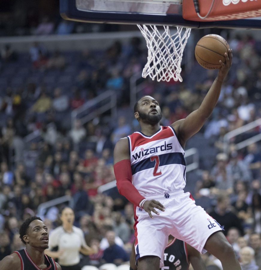 Wizards guard John Wall goes up to make a layup.  The Wizards are ___ to the Raptors ____ in the first round of the 2018  NBA playoffs. 