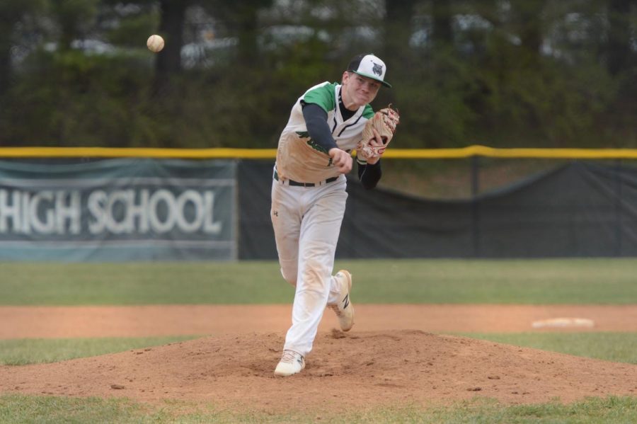 Senior Kyle Peterson pitches a ball to the batter. Peterson struckout nine batters in his no hitter against Watkins Mill.