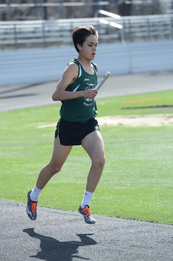 Senior Will Moulec runs a relay during a meet.  Moulec and the team had a solid indoor season.  Photo courtesy of Lifetouch studios.