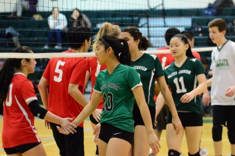 Senior Jessica Lee leads the team in handshakes after a game. Photo by Dakota Craig.