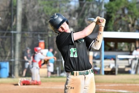 Senior Kyle Peterson hits a ball up at bat. The Wildcats ended their season with a 7-8 record after a loss to Whitman. Photo courtesy of Lifetouch.