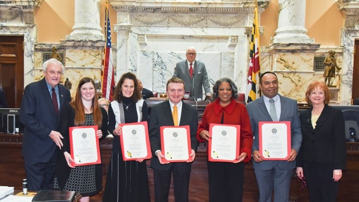 Social studies teacher Tim Rodman (center) won the 2018 Maryland High School Financial Educator of the Year award. Photo credit to Maryland State Department of Education.