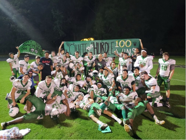 Walter Johnson football celebrates Coach Larry Hurd Jr.’s career win 100, with a win over Springbrook High School, by a score of 50-10. The Wildcats look to continue their early season success against Richard Montgomery this Friday. Photo courtesy of WJ Athletics.
