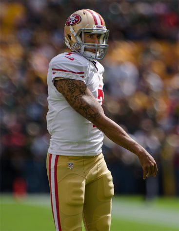 Former 49ers player, Colin Kaepernick preparing for his game against the Green Bay Packers. Photo by Mike Morbeck.