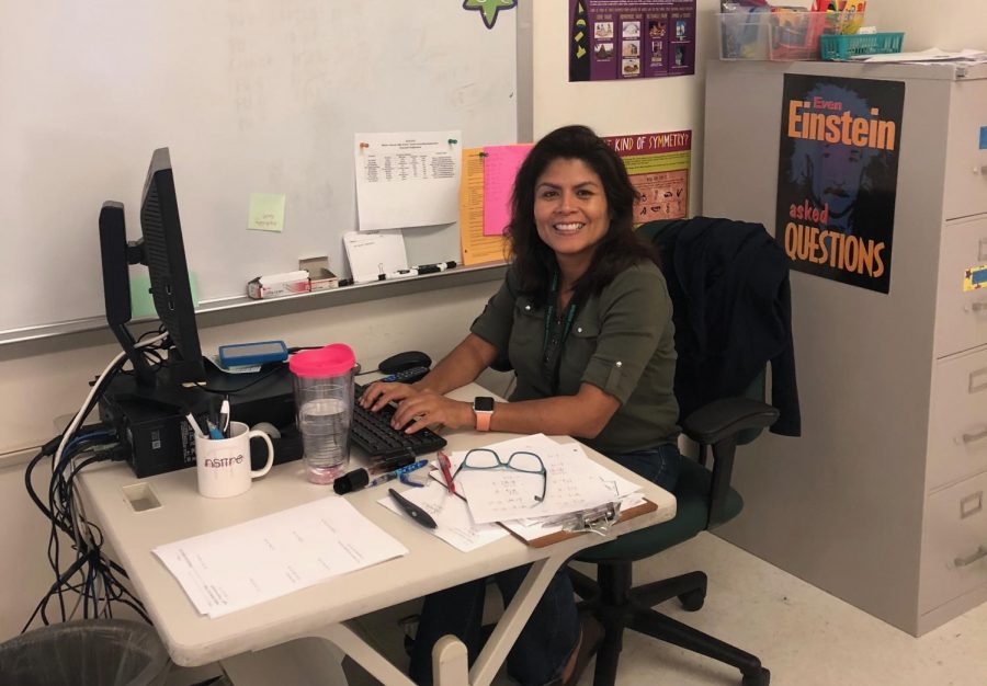 Olga (Lidia) Talavera, a new math teacher here at WJ, works at her computer while students complete a worksheet in her 3rd period Related Math class. Talavera is excited to be working at WJ this year. 