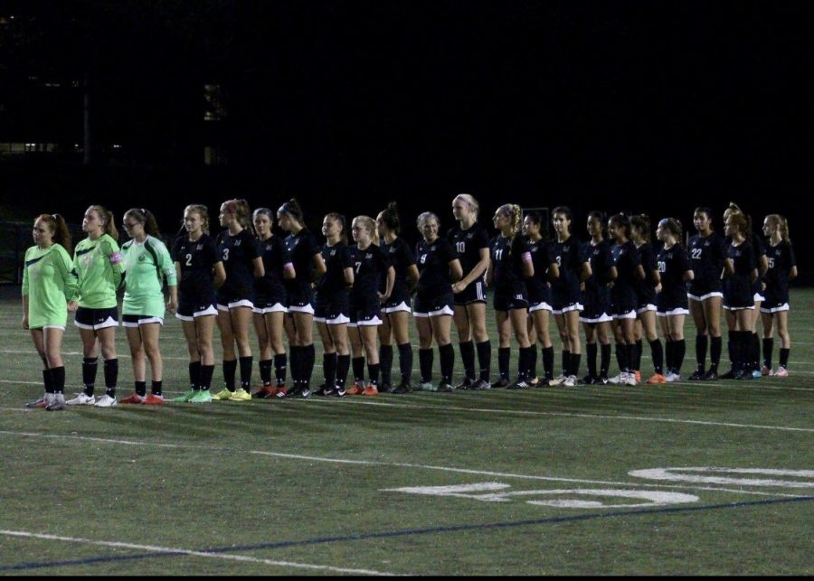 The team stands for the national anthem before their match against Winston Churchill HS. They would later lose to WCHS in the playoffs.