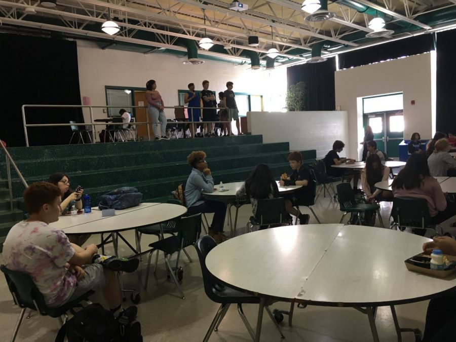 Assistant Principal Vernitta Tucker speaks to students at the first Sit With Us meeting of the new school year. Tucker stands alongside club president Sarah Potts (left), vice president Matt Flynn (right) and member Aiden Cohen (far right). Photo courtesy of Will Cohen