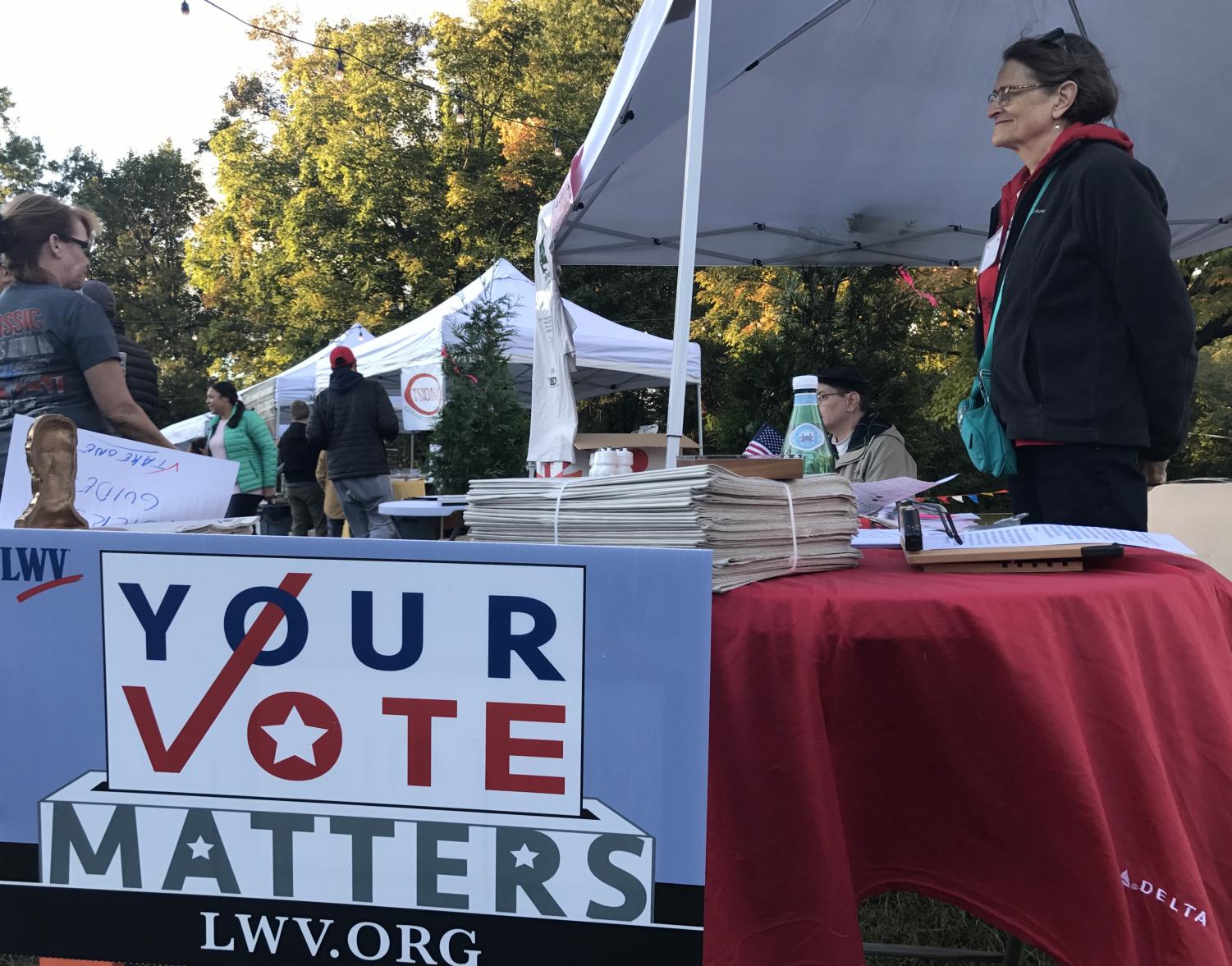 Volunteers set up a voter registration tent at a local festival. Political controversies have caused some formerly indifferent people, along with many newly 18 year old youths to sign up.