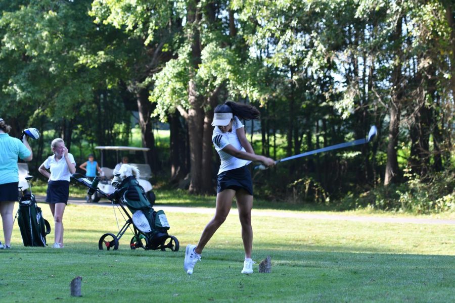 Senior Sabrina Stecklein swings her club at a tee at a seasonal match. She received eighth place for her average in the total ladies district. 