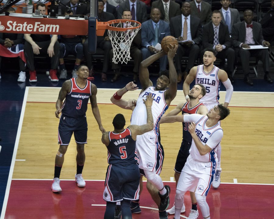 Philadelphia 76ers center Joel Embiid skies in for a rebound against the Washington Wizards. Embiid is a key player on what many expect to be a championship contending team this season. 