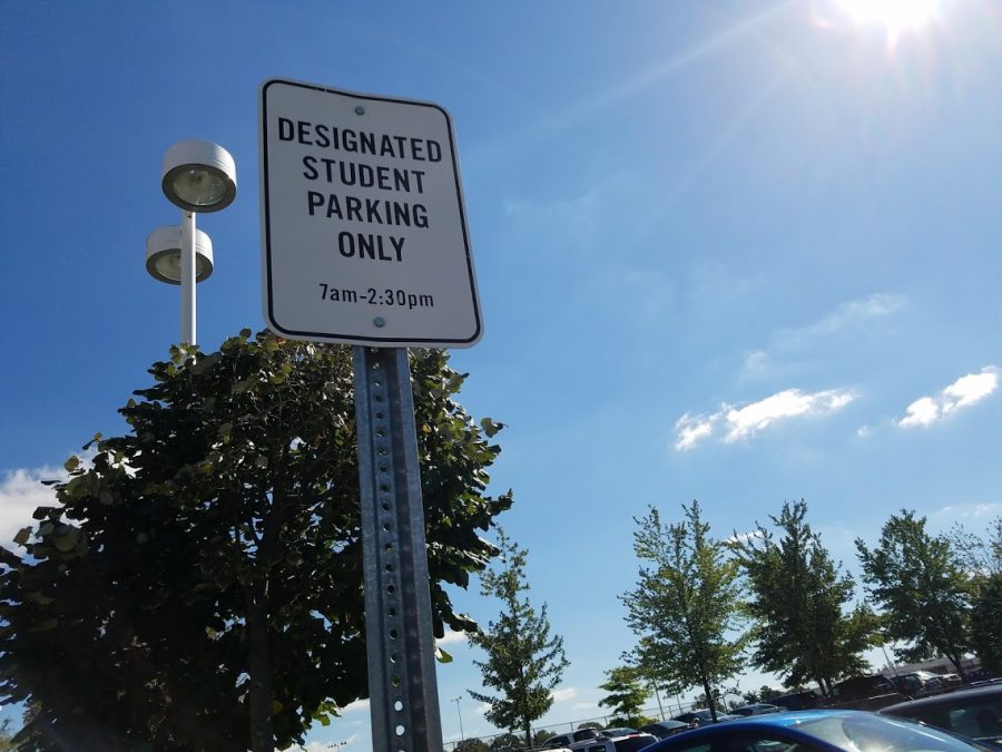 The student parking lot is located behind the school.  Seniors and juniors sometimes take advantage of their license to drive to school. 