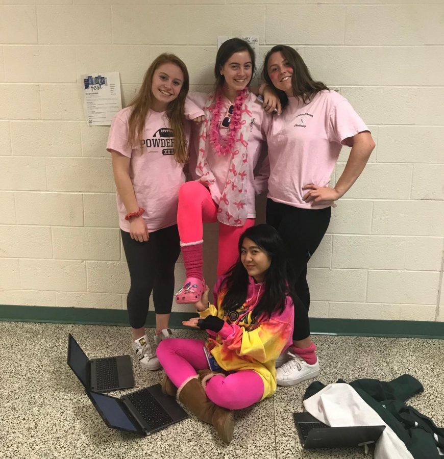 Seniors Grace Burgett, Julia Baumel, Jackie Orsak, and Julianne Okim pose decked out in pink. The tradition of wearing pink on Wednesdays brings joy to students and staff. 