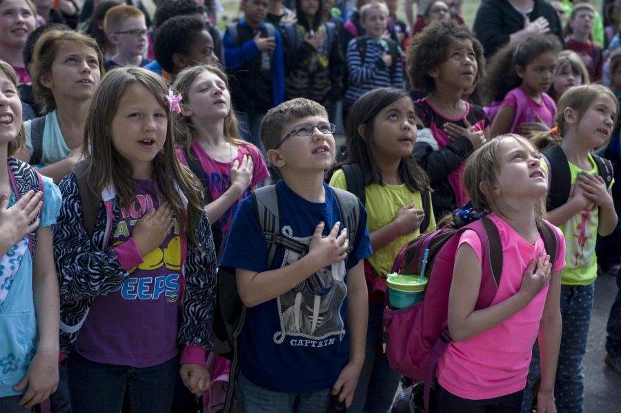 Elementary school students stand for the Pledge. Many WJ students did the same when they were in Elementary school, but most dont stand anymore.