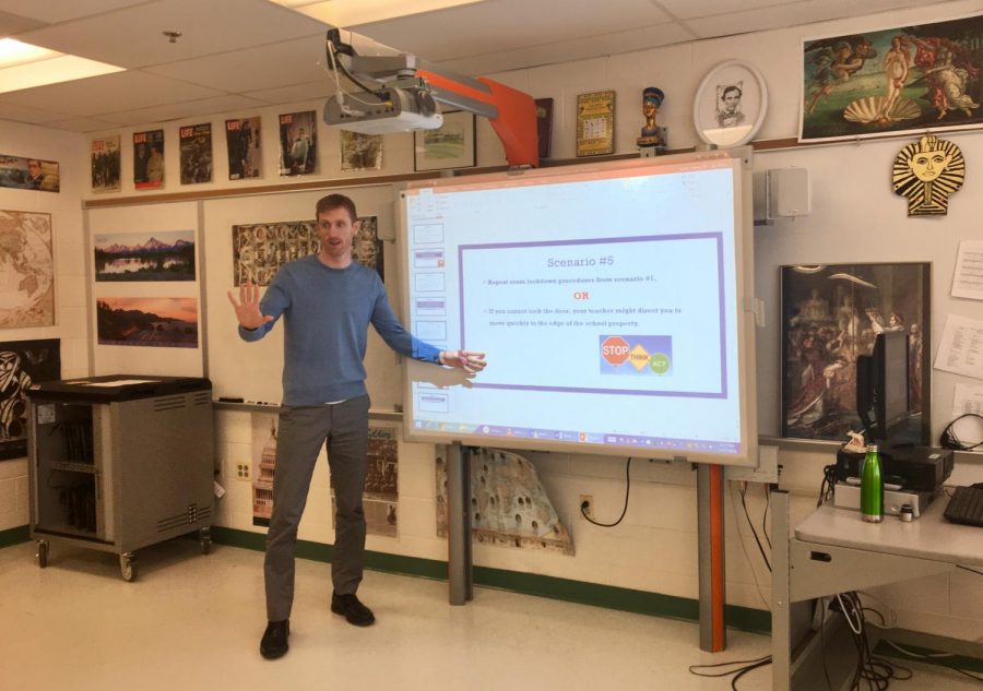Social studies teacher Jeremy Butler explains the scenarios of an active shooter  to his students. Students had the opportunity to comment and ask questions on safety measures during the presentation.  