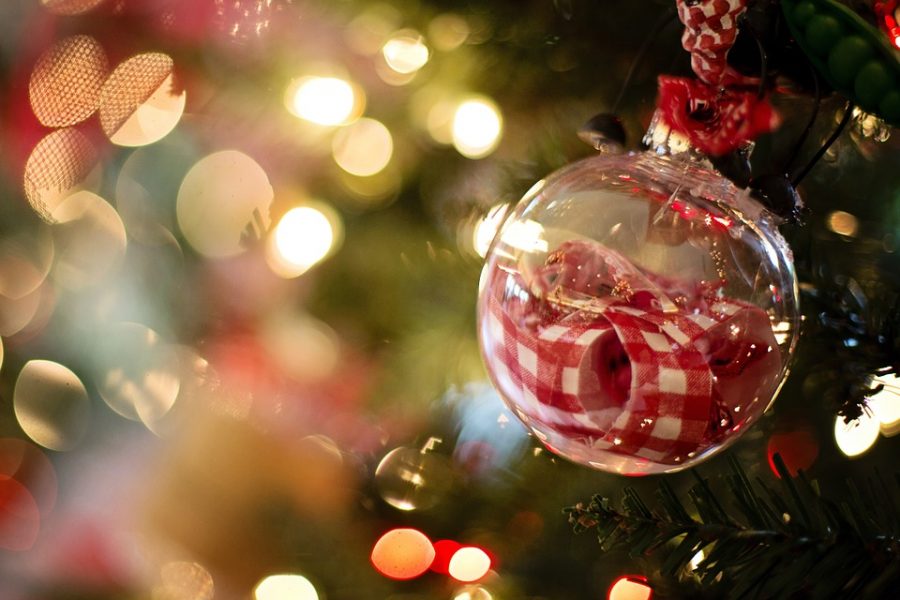 A festive holiday ornament hangs from a tree in celebration of the Christmas spirit. 