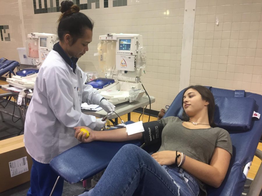 Yael Greenberg gears up for getting her blood drawn with the nurses ready to help. Leadership spent time making sure the event would run smoothly. 