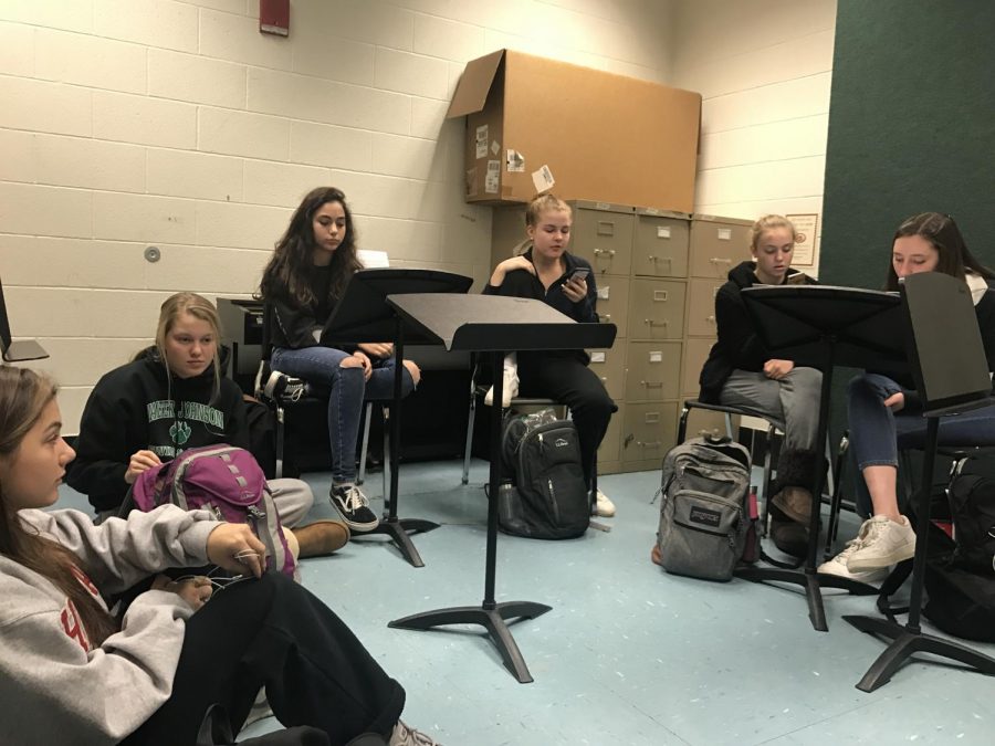 A capella group Vanilla practices during lunch in preparation for the Benefit Concert. The group has performed alongside two other a capella groups at WJ for the two previous concerts.